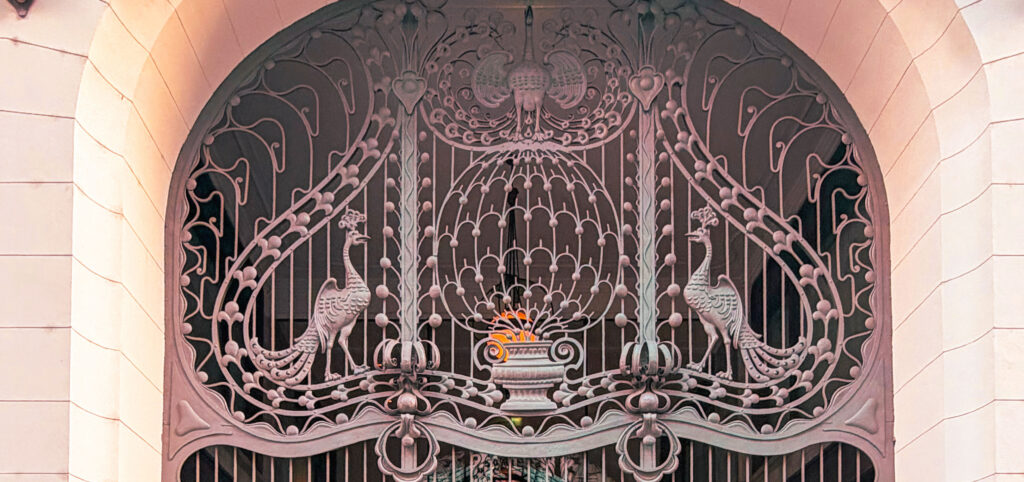 Decorative Art Nouveau peacock motif on the wrought-iron gate of Gresham Palace in Budapest