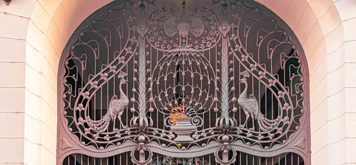 Decorative Art Nouveau peacock motif on the wrought-iron gate of Gresham Palace in Budapest