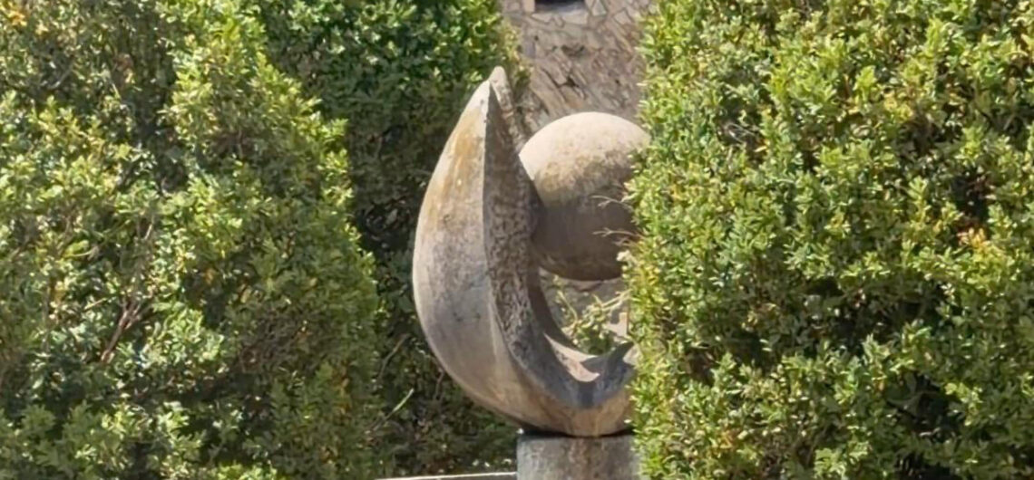 Sculpture among trees in one of the hidden gardens in Buda Castle, Budapest