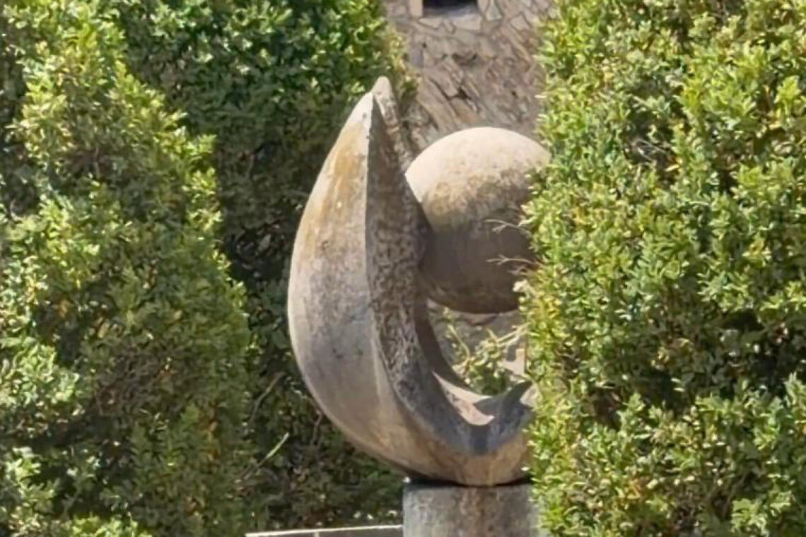 Sculpture among trees in one of the hidden gardens in Buda Castle, Budapest