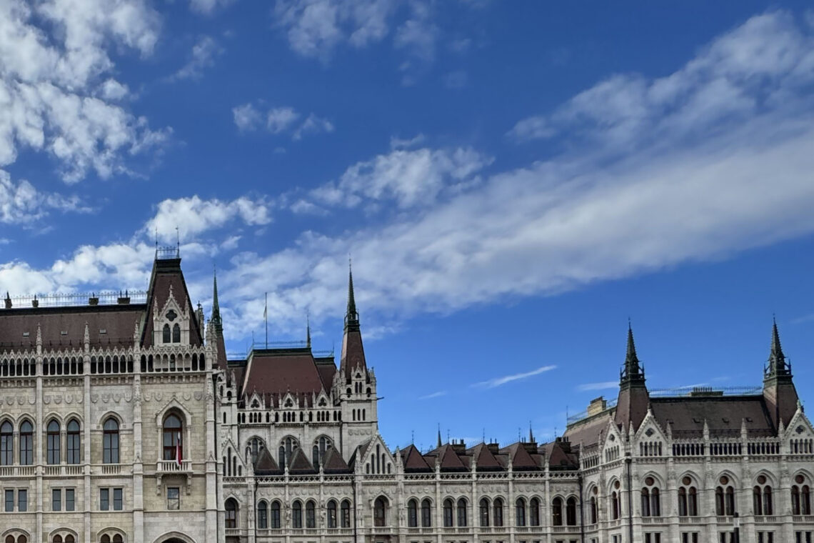 View of the Parliament building in Budapest with blue sky.