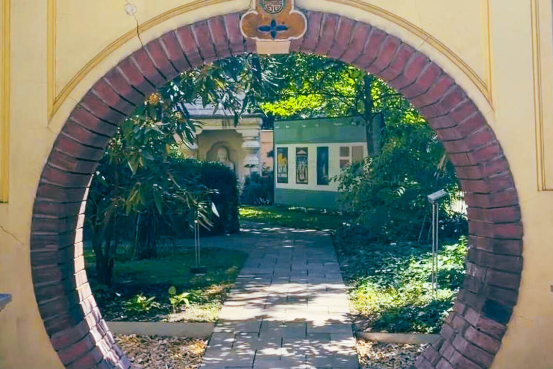 Moon gate leading into the hidden garden of the Hopp Ferenc Museum in Budapest.