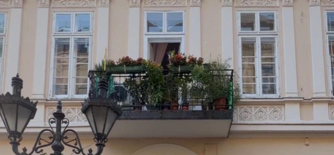 Single balcony on a historic Budapest building façade