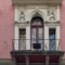 Single balcony on a historic Budapest building façade