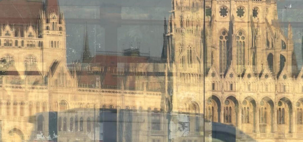 Budapest reflections of the Hungarian Parliament in a glass façade