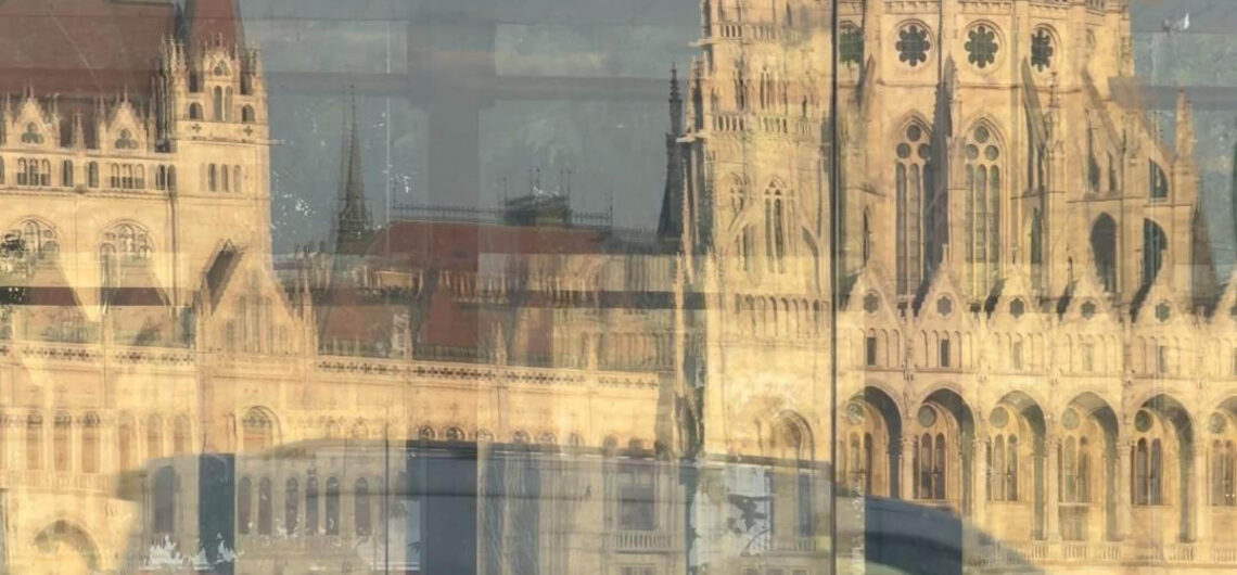 Budapest reflections of the Hungarian Parliament in a glass façade