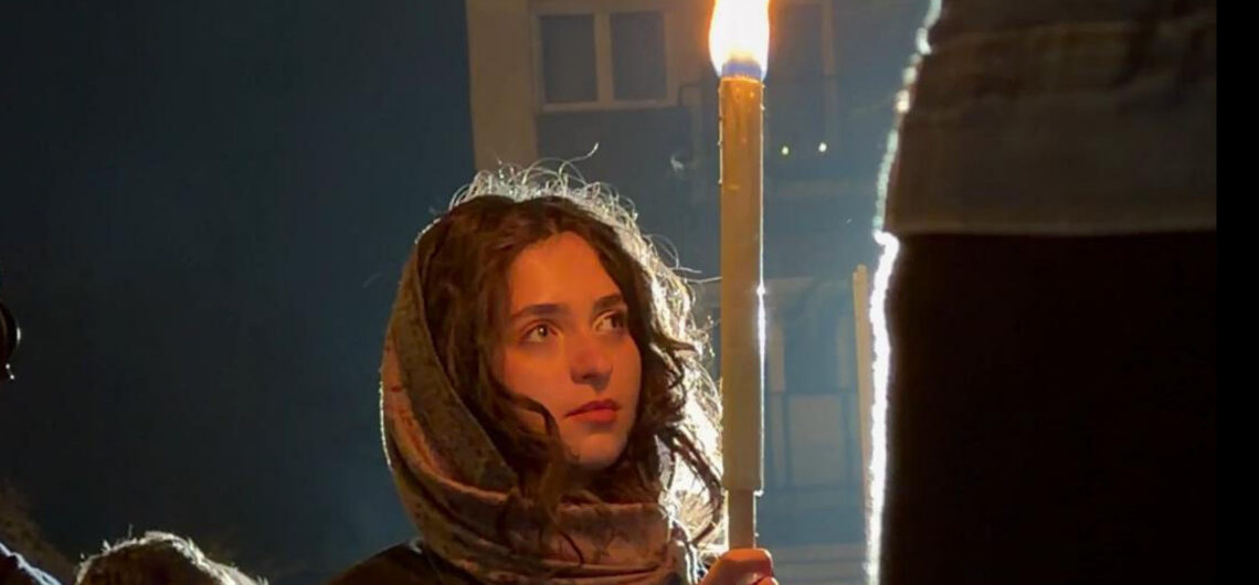 Young woman holding a torch during Budapest's commemorations of the Hungarian Revolution of 1956.