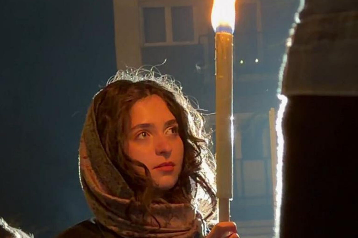 Young woman holding a torch during Budapest's commemorations of the Hungarian Revolution of 1956.