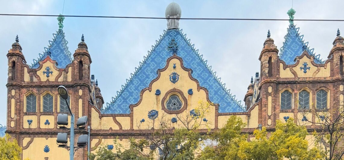 Ödön Lechner’s Hungarian Geological Institute in Budapest, with its blue Zsolnay-tiled roof, curved gables and decorative ceramic details.