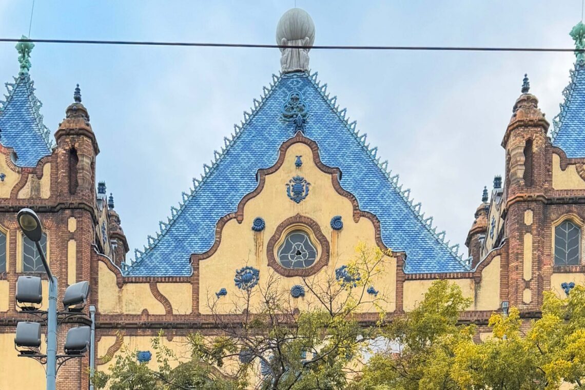 Ödön Lechner’s Hungarian Geological Institute in Budapest, with its blue Zsolnay-tiled roof, curved gables and decorative ceramic details.