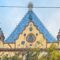 Ödön Lechner’s Hungarian Geological Institute in Budapest, with its blue Zsolnay-tiled roof, curved gables and decorative ceramic details.